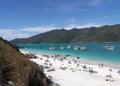 Arraial do Cabo - Beautiful Brazilian beach on the coast of Rio de Janeiro with people, boats and blue sky