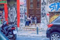 City Athens, Greek Republic. Urban city street with a men who sitting on stairs 17. Sep. 2019