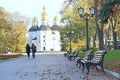 City in autumn. People walk through the autumn city