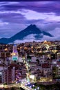 City in the background active volcano at night Royalty Free Stock Photo