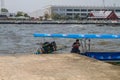City Bangkok, Thailand. River and commercial boat at Bangkok center. Driver sit in boat