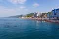 City beach with vacationers tourists in the summer day