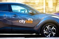 City bee car sharing, short term rental car side view