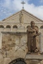 City of Bethlehem. The church Catherine next to the Basilica of the Nativity of Jesus Christ. Column with the figure of Saint Royalty Free Stock Photo