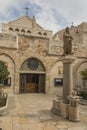 City of Bethlehem. The church Catherine next to the Basilica of the Nativity of Jesus Christ. Column with the figure of Saint