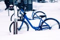 City bikes in the Parking lot covered with snow Royalty Free Stock Photo