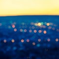 City blurring lights abstract circular bokeh blue background wit Royalty Free Stock Photo