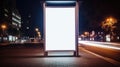 At a city bus stop, a blank white vertical digital billboard poster stands illuminated at night, Ai Generated Royalty Free Stock Photo