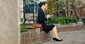 City, business and woman with smartphone, smile and typing with connection, online news and digital app. Japan, person