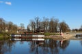 City canal with deocrative lighthouse and steam-ship at the coast. Popular waterscape in the city of Jelgava