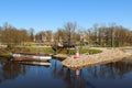 City canal with deocrative lighthouse and steam-ship at the coast. Popular waterscape in the city of Jelgava