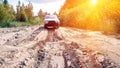 City car moves on a broken dirt road Royalty Free Stock Photo