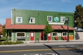 City of Carnation green wooden building with sign and red wrap around awning