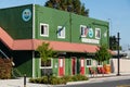 City of Carnation green wooden office building with red wrap around awning