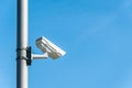 City cctv security surveillance camera system attached on the traffic light pole with clear blue sky background Royalty Free Stock Photo