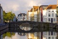 City center of Bruges in Belgium with a view of a canal - cloudy day