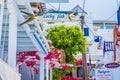 City center of mykonos, with his famous white houses, red flowers and blue doors. Greece