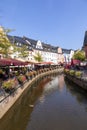 city center of Saarburg with creek and restaurants at the promenade. The creek is the source for the water mills at bottom of