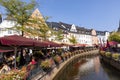 city center of Saarburg with creek and restaurants at the promenade. The creek is the source for the water mills at bottom of