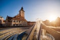 City central square (Piata Sfatului) with town council hall tower, fountain morning sunrise view, location Brasov, Transylvania, Royalty Free Stock Photo