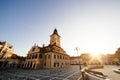 City central square (Piata Sfatului) with town council hall tower morning sunrise view, location Brasov, Transylvania, Romania. Royalty Free Stock Photo