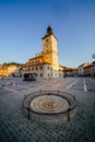 City central square (Piata Sfatului) with town council hall tower morning sunrise view, location Brasov, Transylvania, Romania. Royalty Free Stock Photo