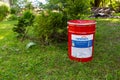 City Cesis, Latvia. Paint bucket 20 liters and grass