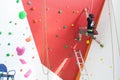 City climbing wall, athletes equip tracks for climbing walls.