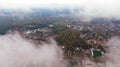 City through the clouds. Aerial view of autumn lanscape