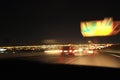 City colorful night lights perspective blurred by high speed of the car. A streak of light, trails in USA