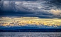 The city Constance on the Lake Constace, Bodensee. The view of sunset at the snowy mountains Alps. Thelake lies in Germany,