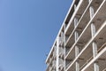 Facade of concrete building against blue sky background