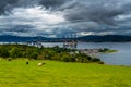 City Of Cromarty With Cattle On Pasture And Oil Rigs In The Cromarty Firth In Scotland