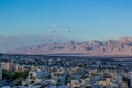 City in desert top view landscape scenery photography with small buildings foreground and perspective sand stone mountain ridge Royalty Free Stock Photo