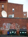 City: two dumpsters in alley