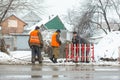 City emergency service repairs broken water pipe in winter Royalty Free Stock Photo