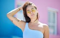 City, fashion and portrait of woman with sunglasses for cool and trendy summer style on holiday. Asian, Gen Z and urban