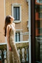 City fashion. Sensual woman on balcony. Girl outdoor. Fashionable portrait. Royalty Free Stock Photo