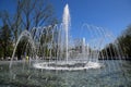 City fountain in the city of Krasnodar. People are walking by the fountain. Water splashes.