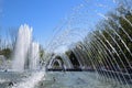 City fountain in the city of Krasnodar. People are walking by the fountain. Water splashes.