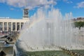 City fountain, water jets with a rainbow on a sunny day