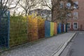 City garden with colorful fence