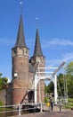 City gate Oostpoort, drawbridge and biker in Delft Royalty Free Stock Photo