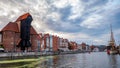 City Gdansk with the oldest medival port crane called Zuraw and a promenade along the riverbank of Motlawa River. Royalty Free Stock Photo