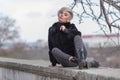 City girl resting at public park in overcast autumn day Royalty Free Stock Photo