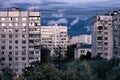 City gloomy high-rise buildings on a background of cloudy sky. Evening urban landscape in a dreary area Royalty Free Stock Photo