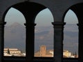 The city of Granada framed by the arches of a portico