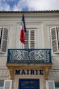 City hall facade with mairie text means in french mayor town hall in France with flag Royalty Free Stock Photo