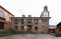 The City Hall with its clock tower and bell tower in the square of the conqueror Pizarro in Robledillo of Gata