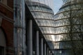 City Hall, London taken from the rear at dusk. Building is reflected in the glass facade of the adjacent building. Royalty Free Stock Photo